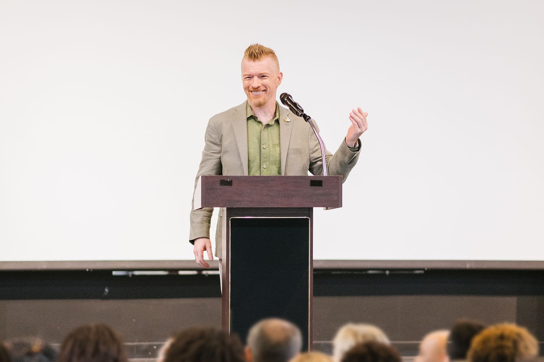 Shane Lukas speaking at a 2025 event